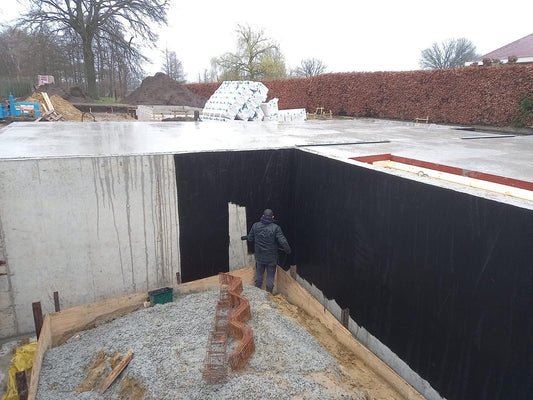 The GOAT liquid waterproof membrane applied to below-ground concrete foundation walls during construction