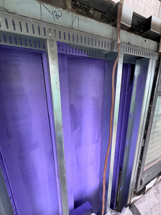 Passive Purple Internal airtight membrane between steel frame on a high-rise construction 