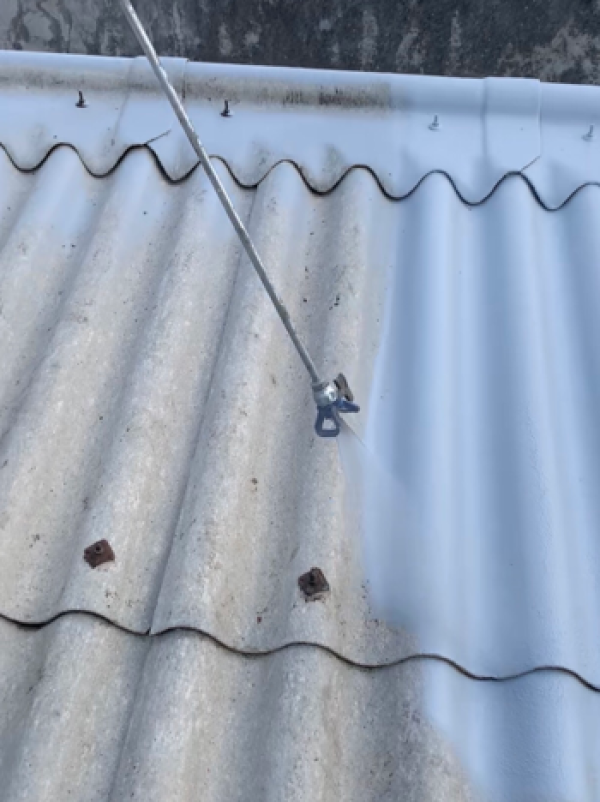 Soteria asbestos encapsulation coating applied to a corrugated asbestos cement roof, sealing fibres in place
