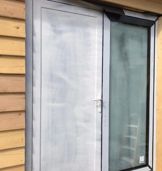 French door sprayed with Intelligent Protect peelable surface protection film during construction