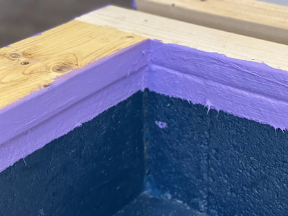“Close-up of kicker block sealed with liquid damp proof membrane paint.”