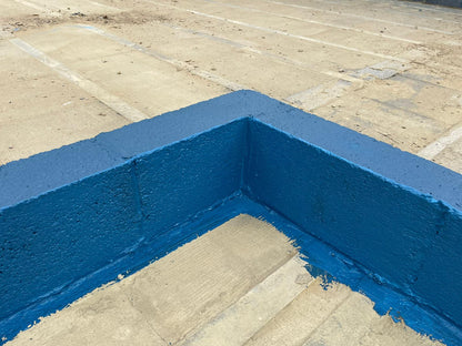 “Protective waterproof DPM liquid paint forming barrier on kicker block.”