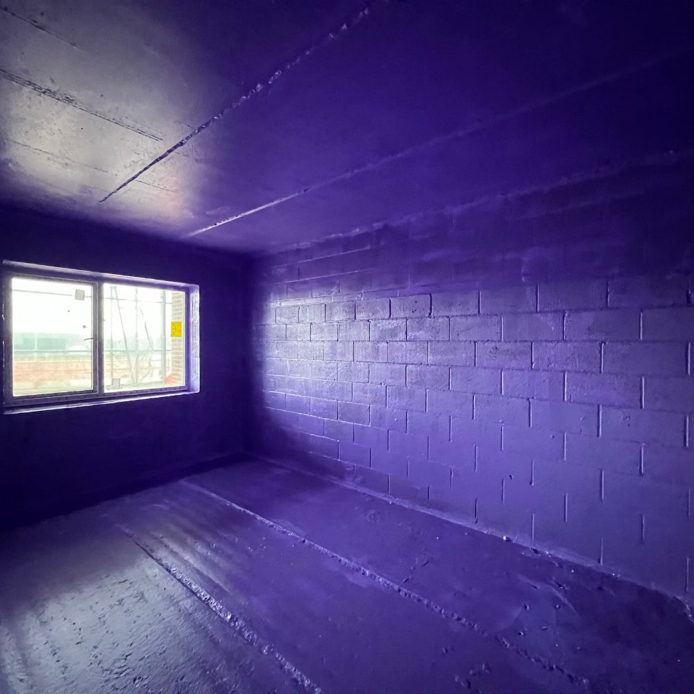 "Finished airtight building coated with Passive Purple liquid membrane for full internal and external airtightness"
